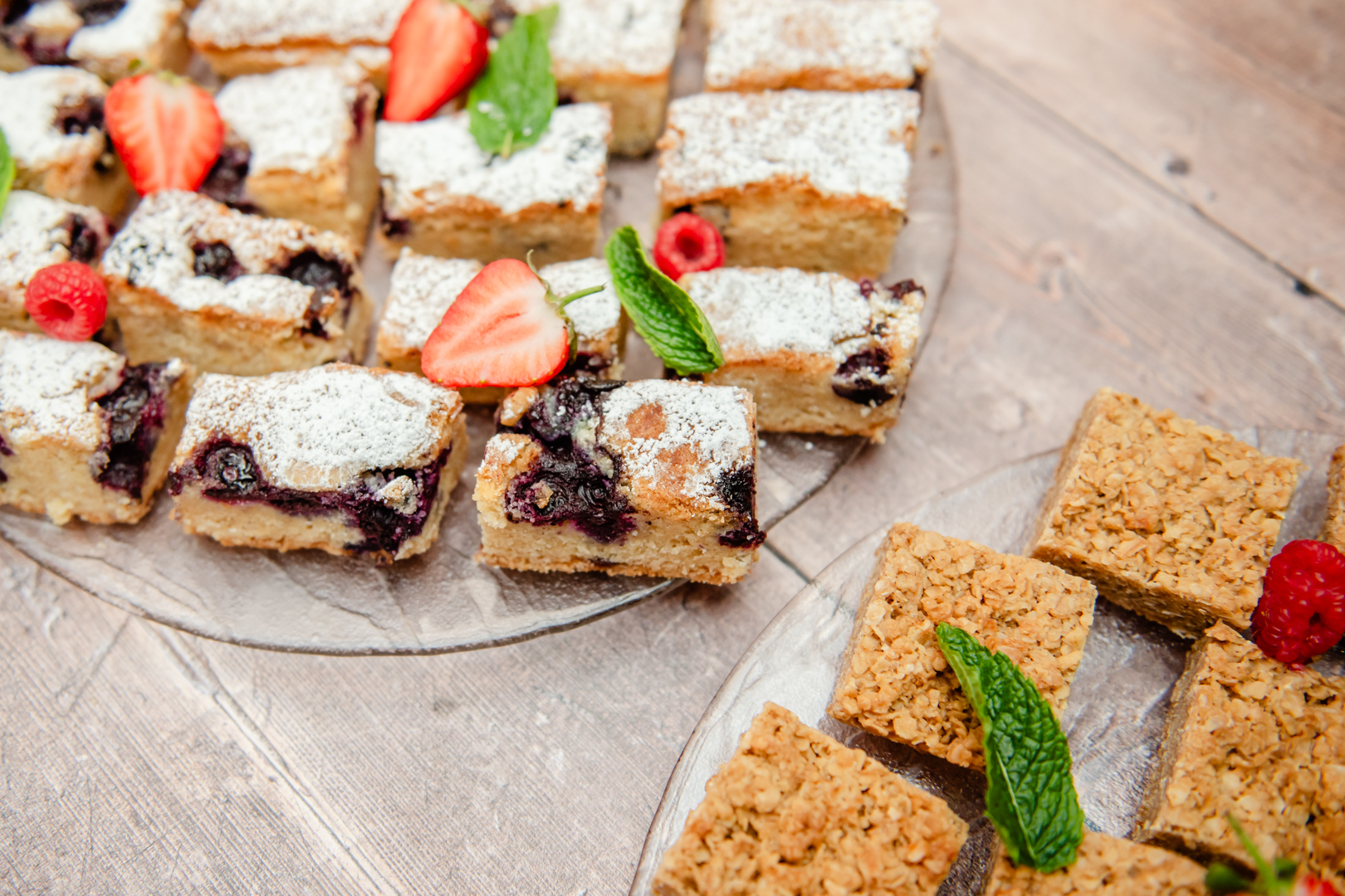 blueberry and almond slice on a platter with strawberries for outside catering events from Saxtons Deli